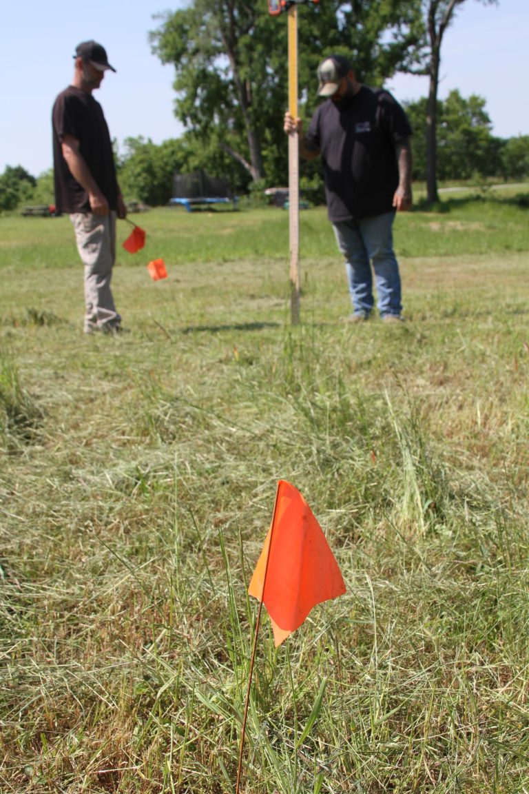 marking yard with flags for septic install by on grade septic in kentucky