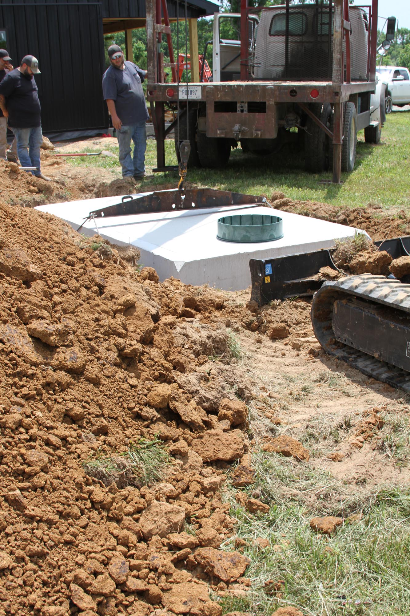 septic tank being placed into new residential installation